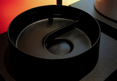 Laufen’s artisanal basin with organic, river-inspired contours.