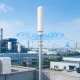Fiberglass omni antenna deployed in industrial park for IoT wireless communication infrastructure