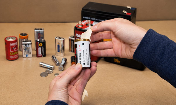 Rechargeable battery terminal taping