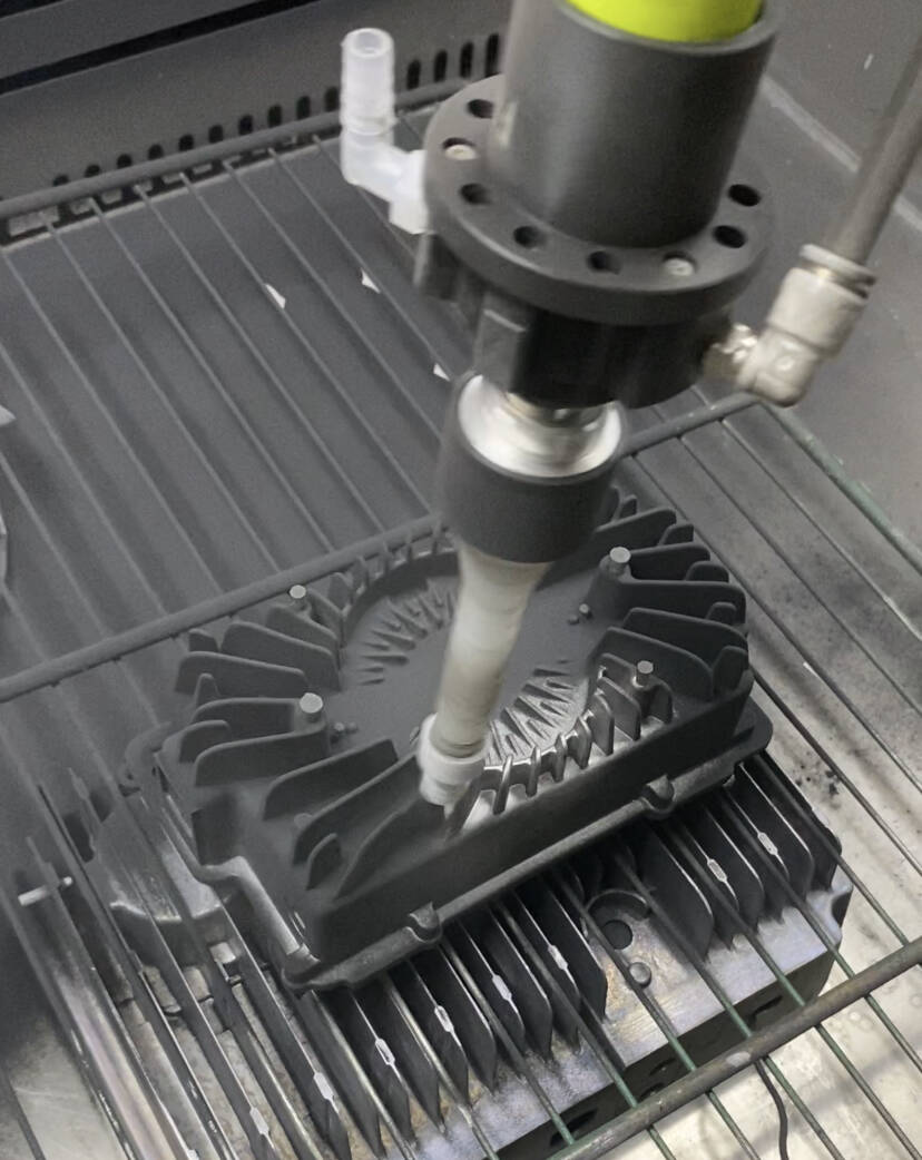 Rotary cup spray gun coating complex metal heat sink parts with QXD powder coating machine