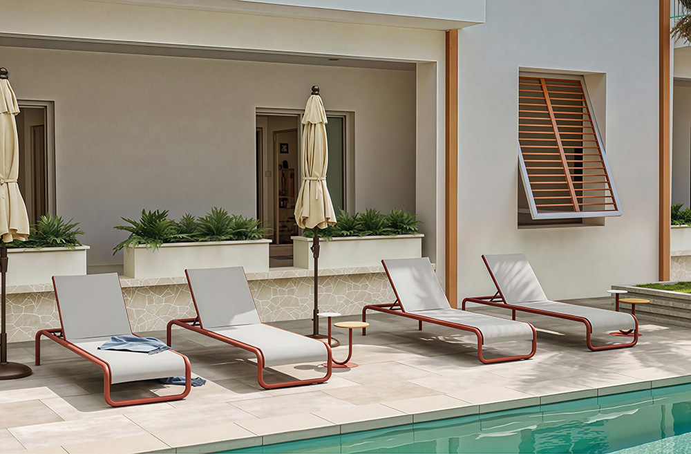 weather resistant hotel sun loungers by swimming pool
