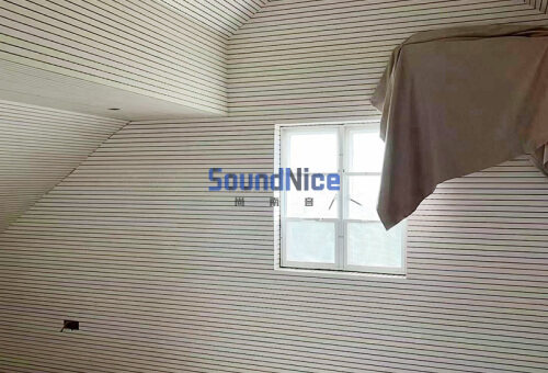 Installation of Grooved acoustic panel on the wall of piano room
