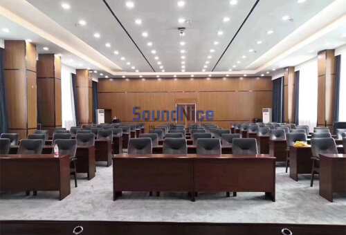 Report Hall  uses grooved  acoustic panels